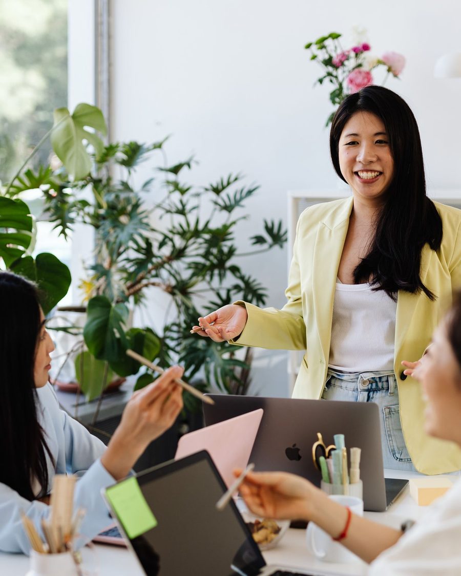 Women collaborating around a table in a modern office
